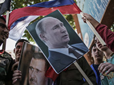 Участники митинга в поддержку президента Сирии Башара Асада и президента России Владимира Путин в Латакии. 2013 год. Участники митинга в поддержку президента Сирии Башара Асада и президента России Владимира Путин в Латакии. 2013 год.