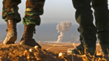 Бойцы курдского военизированного формирования пешмерга в 25 километрах к северо-востоку от Мосула