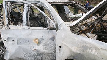 Место подрыва автомобиля сотрудников патруля Специальной мониторинговой миссии ОБСЕ на Украине в районе населенного пункта Пришиб в Луганской области